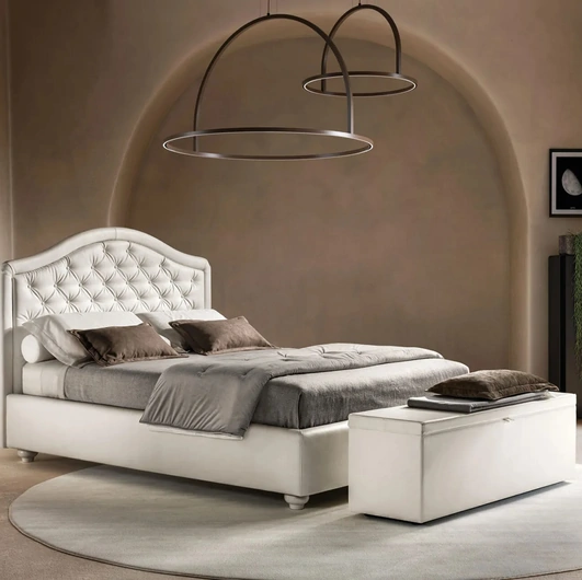 Letto in ecopelle con testiera sagomata e trapuntata Infinity di BsideLetto in ecopelle con testiera sagomata e trapuntata Infinity di Bside