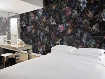 Carta da parati con fiori colorati su fondo scuro Rio di London Art